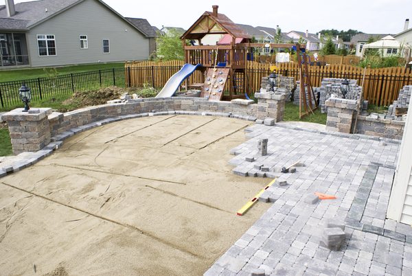New construction landscaping — retaining wall, paver patio and grading